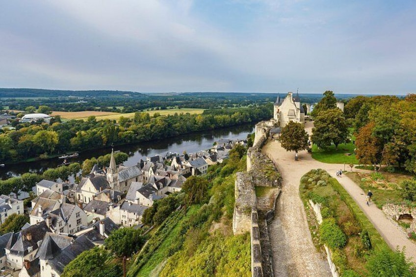 A historic town with a river, a church, and a castle. 5