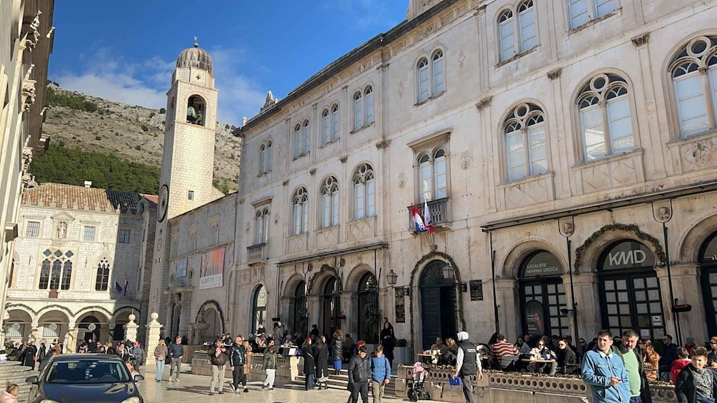 A historic building with arched windows and a bell tower. 2