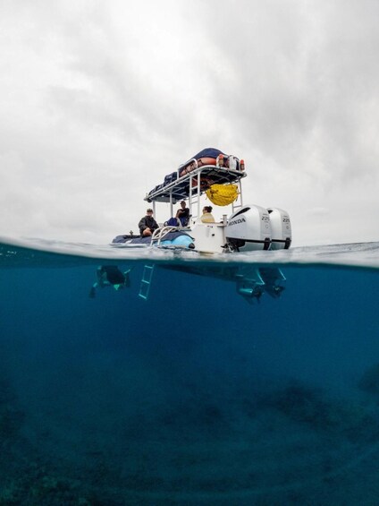 A boat with divers on a cloudy day. 3