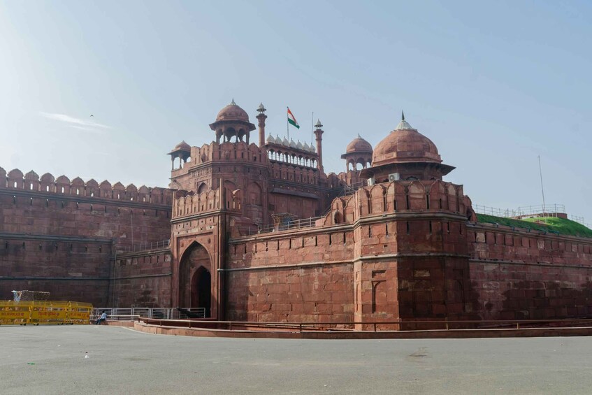 A large, historic fort with multiple domes and a prominent archway. 3