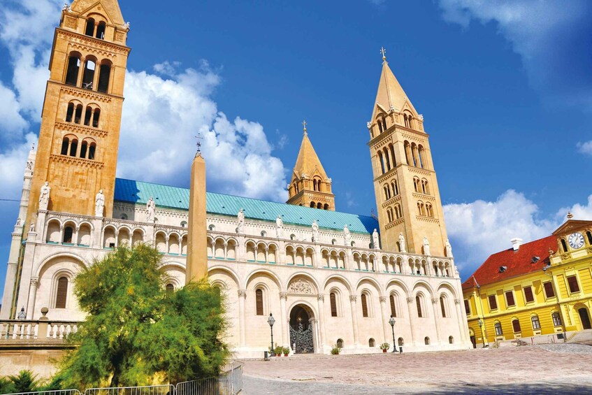 A historic building with two prominent towers and a central dome. 4