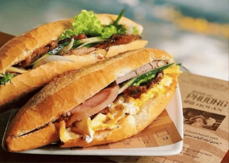 A sandwich with lettuce and egg on a plate. 2