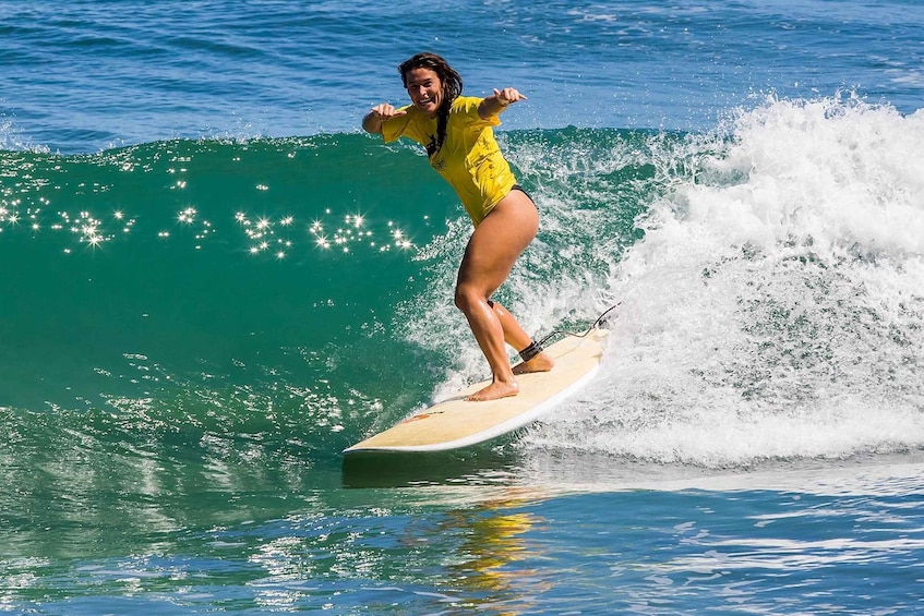 A person surfing a wave in the ocean. 1
