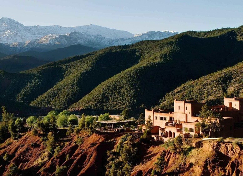 A mountainous landscape with a village nestled among the hills. 1
