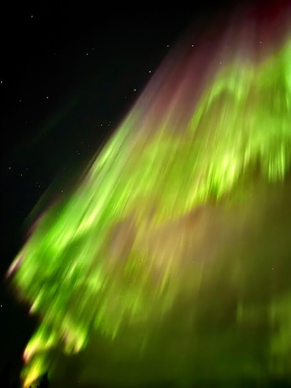 A night sky with green aurora lights. 4