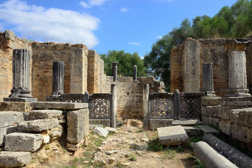 Ancient ruins with stone columns and walls. 5