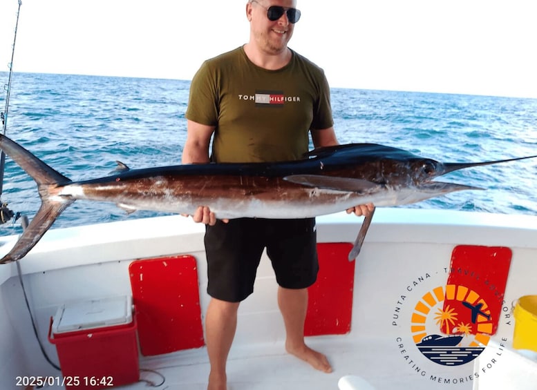 A person holding a large fish on a boat. 2