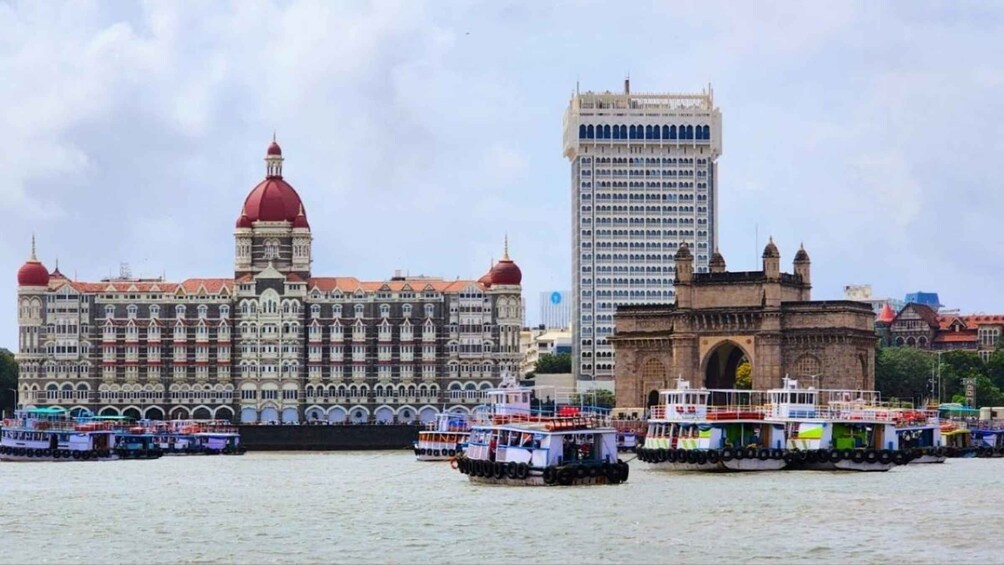 The Gateway of India, Mumbai, with boats in the foreground and the Taj Mahal Palace Hotel in the background. 1
