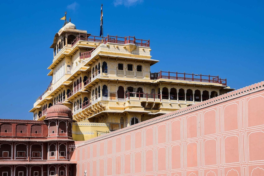 A multi-tiered palace with intricate architecture and a clear blue sky. 3