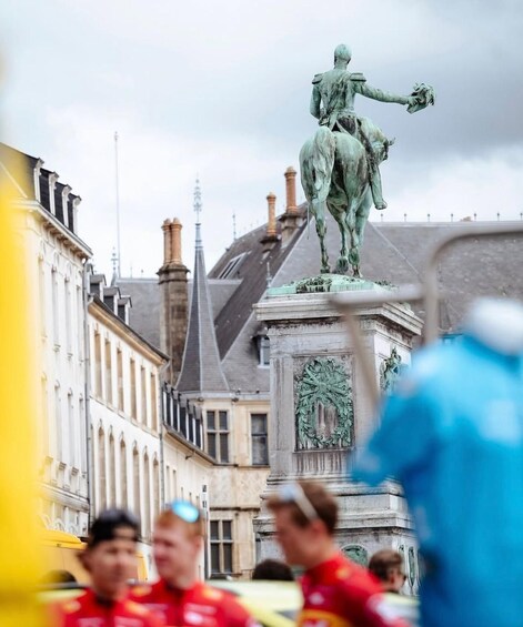 A statue of a man on horseback in a city square. 3