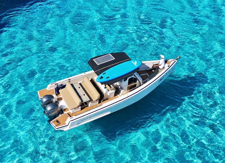 A yacht on clear turquoise water. 3
