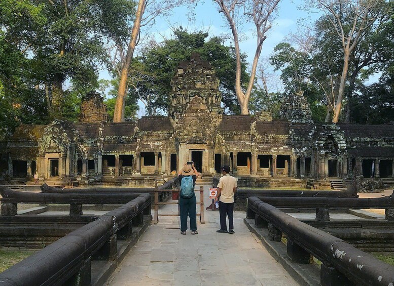 A temple complex with stone structures and a pathway leading to the entrance. 5
