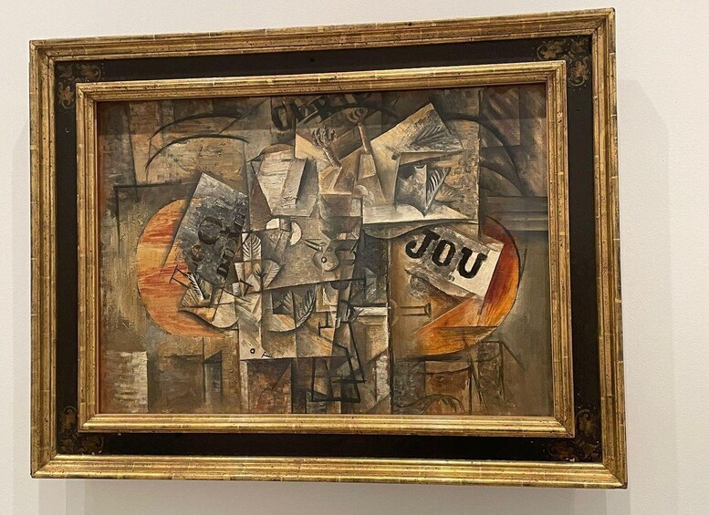 A framed abstract painting with geometric shapes and the word "YOU" visible. 3