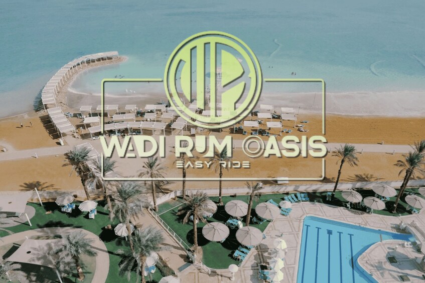 A resort with a pool, beach, and palm trees. 1