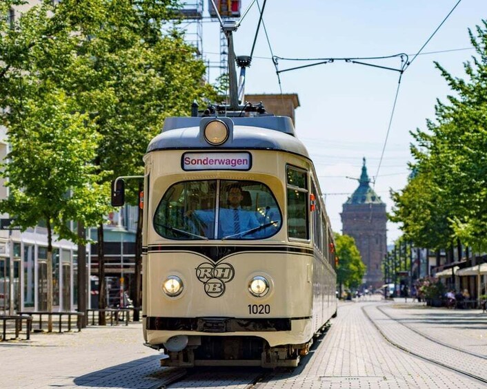 A vintage tram with the number 1020 on a city street. 2
