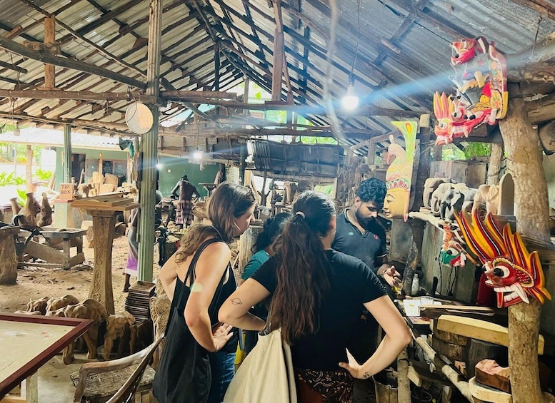 A market with wooden carvings and masks. 2
