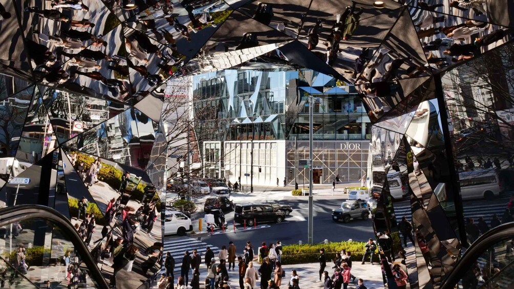 A modern building with a glass facade and a Dior store. 3