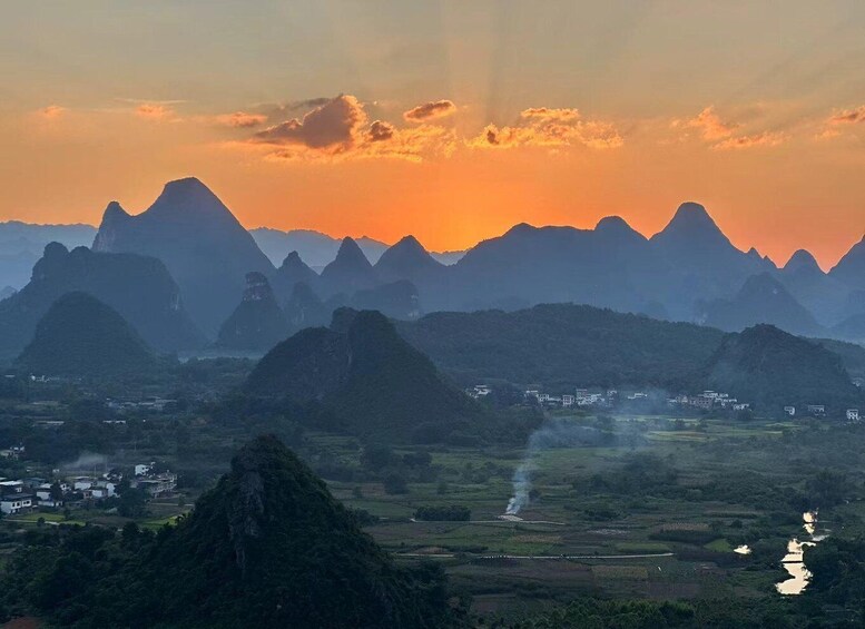 A mountainous landscape with a sunset. 3