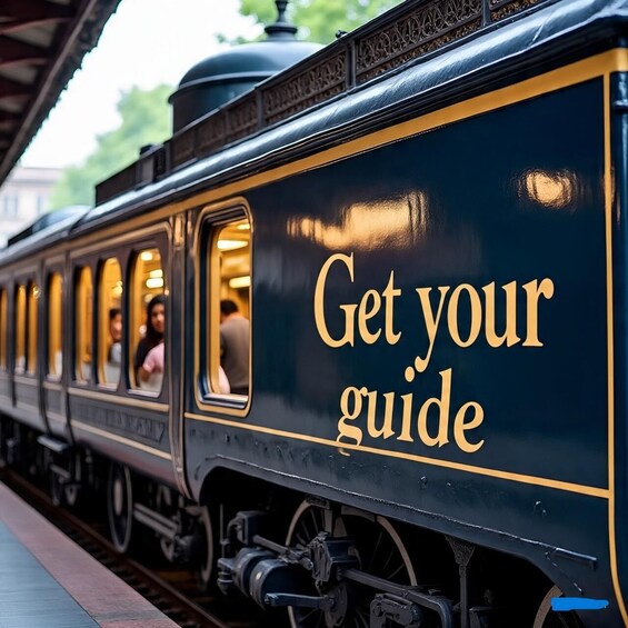A train with 'Get your guide' written on its side. 1
