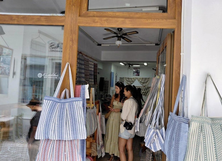 A boutique with patterned bags on display. 5