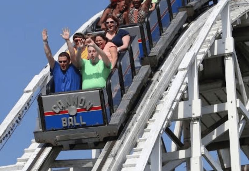 A roller coaster with passengers in mid-ride, labeled 'CANON BALL.' 5