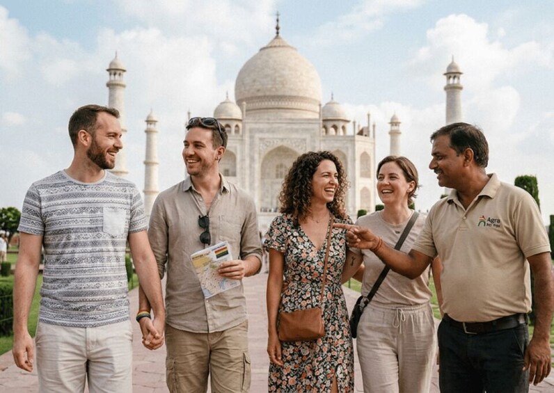 A group of people walking in front of the Taj Mahal. 4