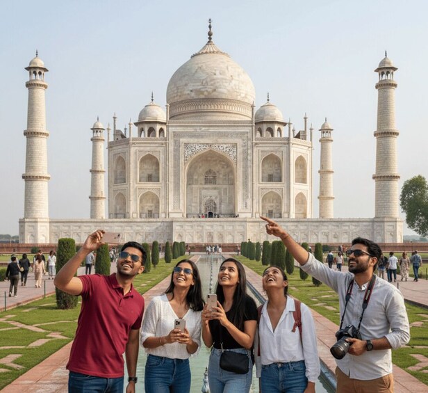 A group of people taking a selfie in front of the Taj Mahal. 1