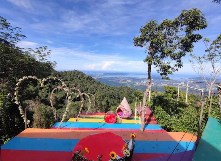 A colorful playground with a heart-shaped vine arch, a cone-shaped structure, and a red circular platform with sunflowers. 2