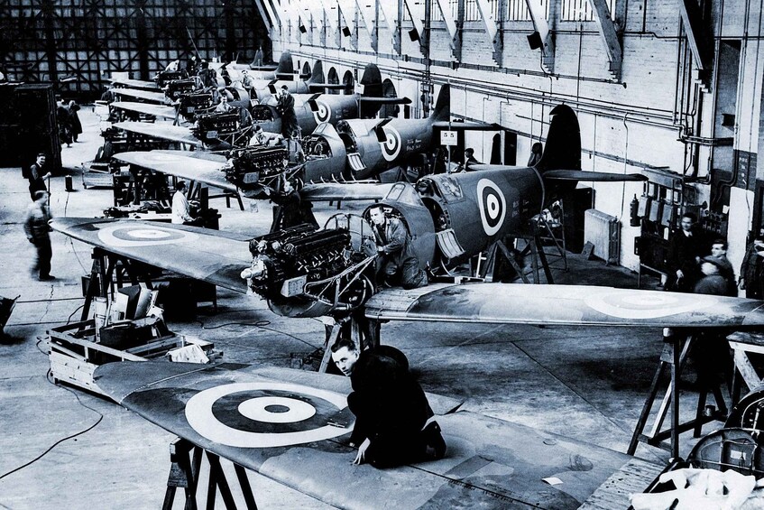 Vintage military aircraft in a hangar. 3