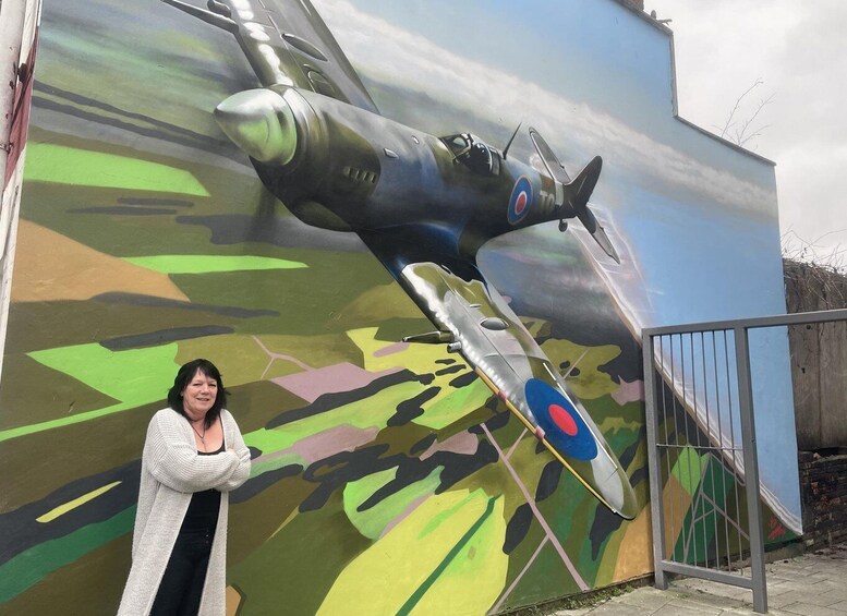 A mural of a military aircraft on a wall. 1