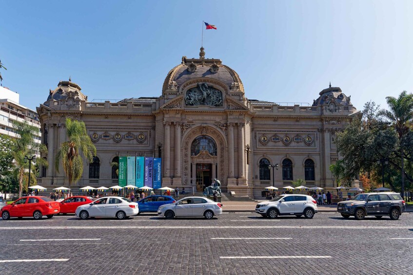 A historic building with a large dome and a flag on top. 3