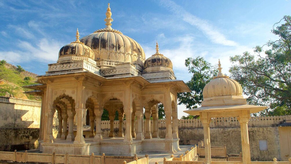 A historic building with multiple domes and arches. 5