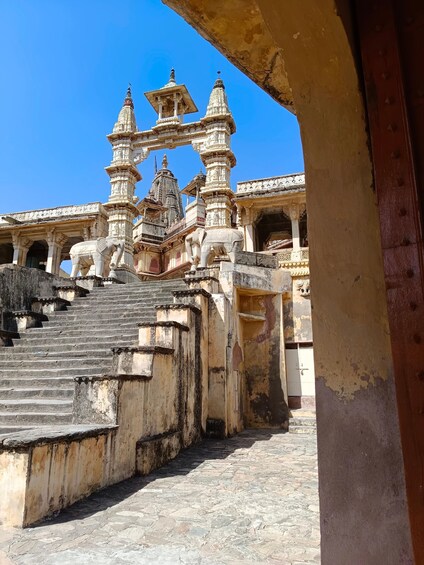 A temple with intricate carvings and a large elephant statue. 3