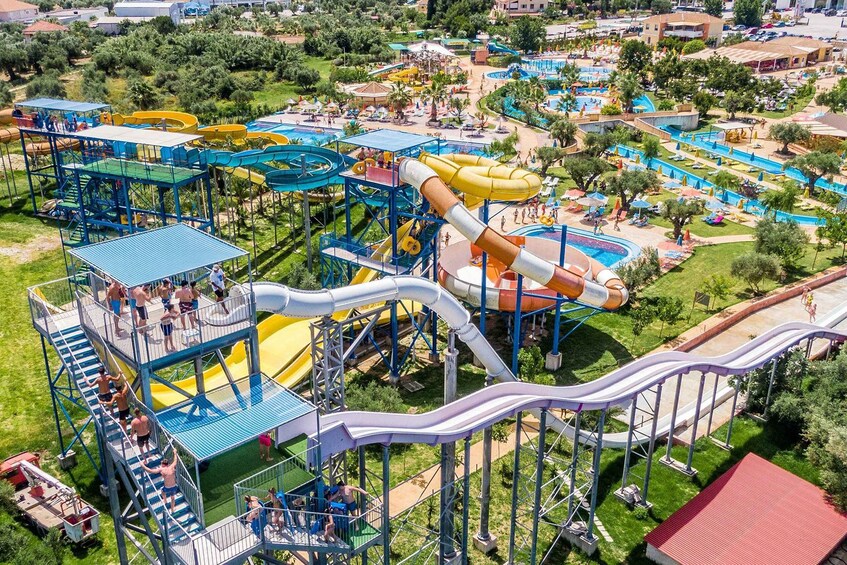 A water park with multiple slides and pools. 3