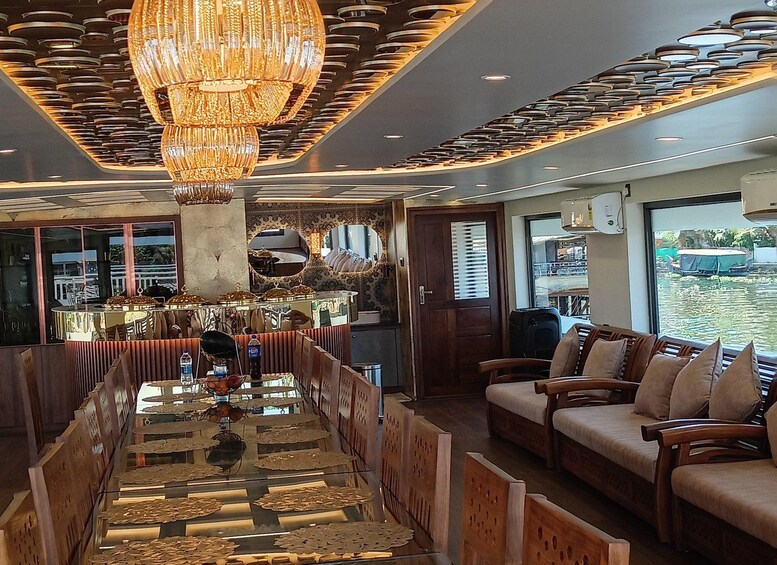 A modern interior with a central dining area, wooden furniture, and a large chandelier. 2