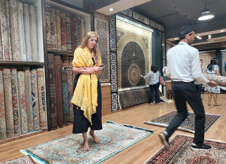 A carpet store with various carpets on display. 1