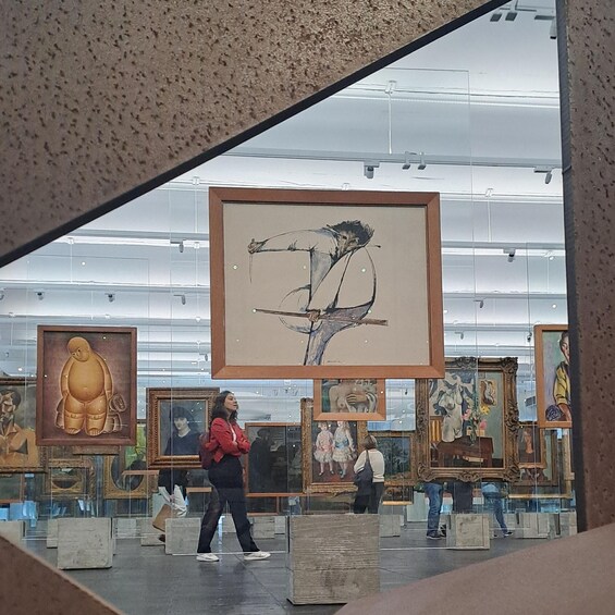 An art gallery with various paintings on display. 5