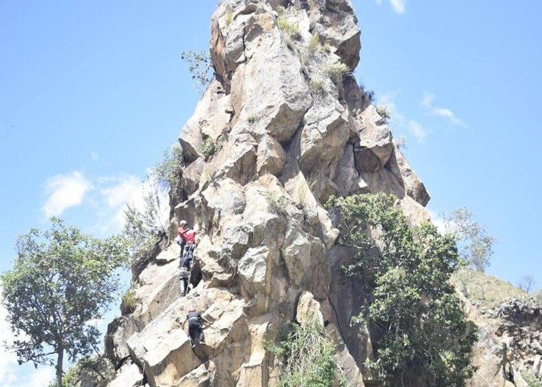 A person climbing a rocky mountain. 3