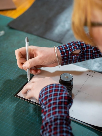 A person drawing on a tablet with a stylus. 2