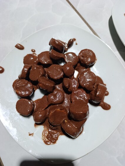 A plate of chocolate-covered candies. 4