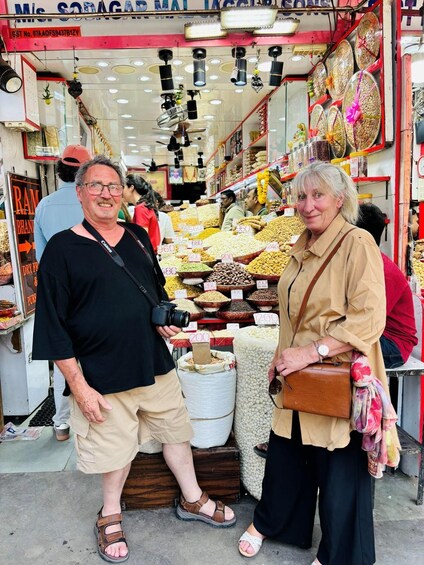 A market stall with various food items on display, including nuts and dried fruits. 5