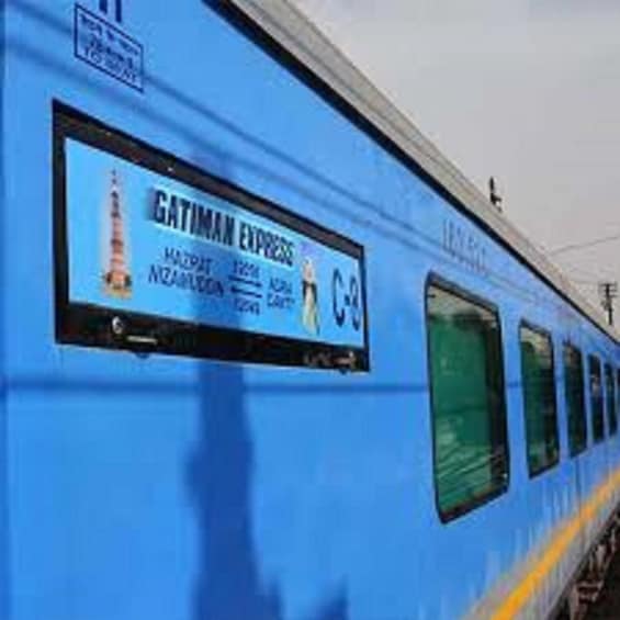 A blue train with a sign that reads 'GATIMAN EXPRESS' and 'NACAPAT NICOALDO'. 5