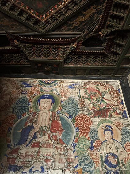 A detailed mural with intricate designs and figures. 4