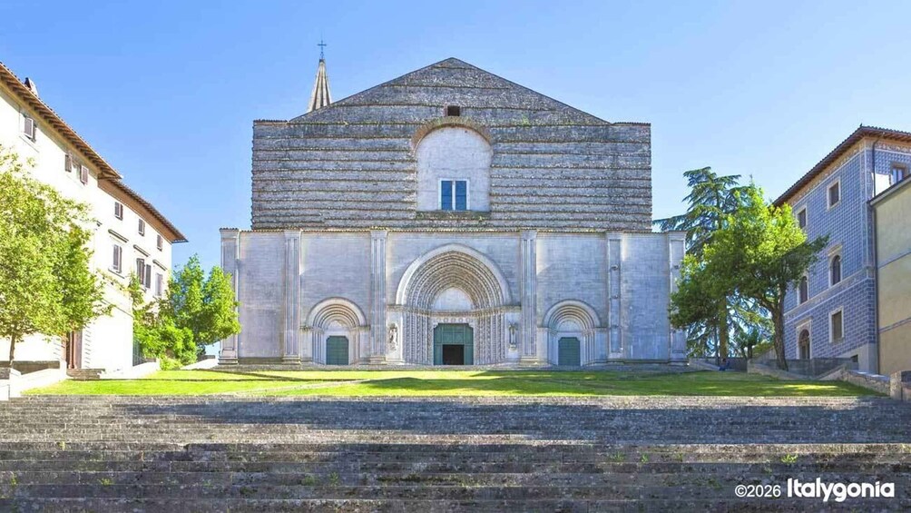 A historic church with a central dome and arched entrances. 3