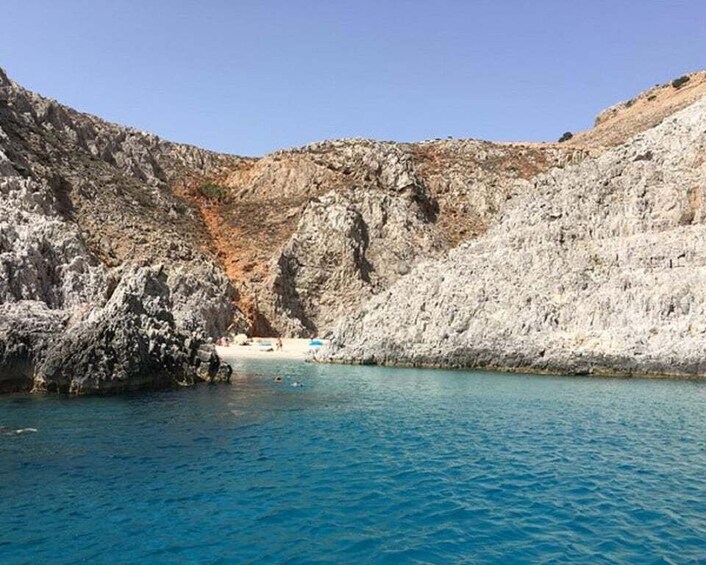A rocky coastline with clear blue water. 5
