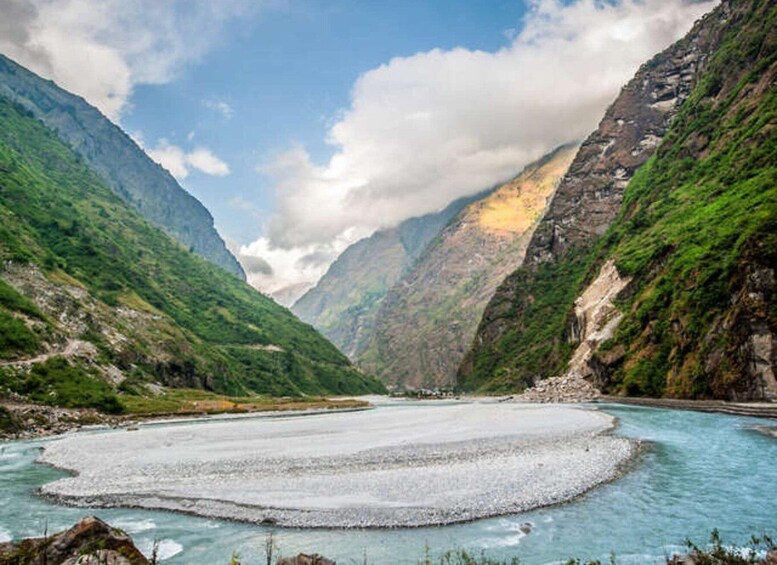 A river with a glacier in a mountainous valley. 2