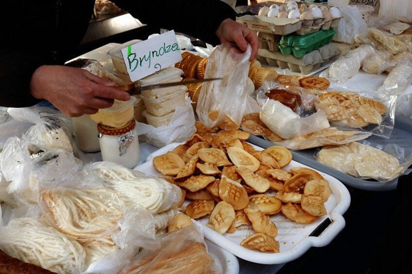 A variety of food items, including a tray of chips, a bowl of yogurt, and a container of milk. 4