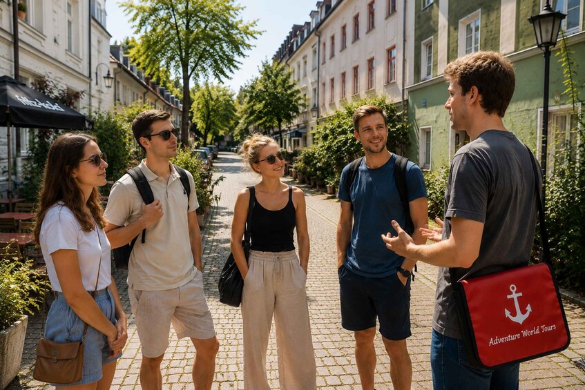 A group of people standing on a cobblestone street with buildings on either side. 3