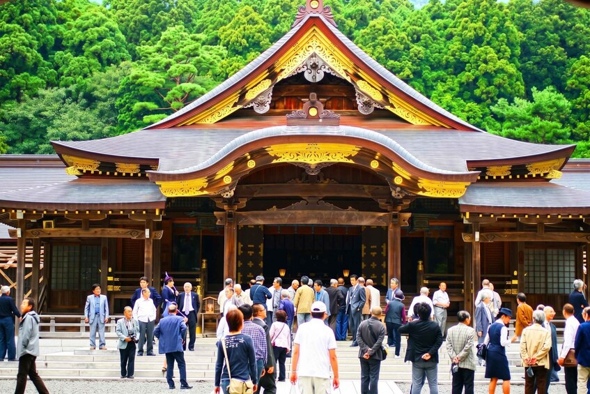 A traditional Japanese building with a curved roof and ornate decorations. 1