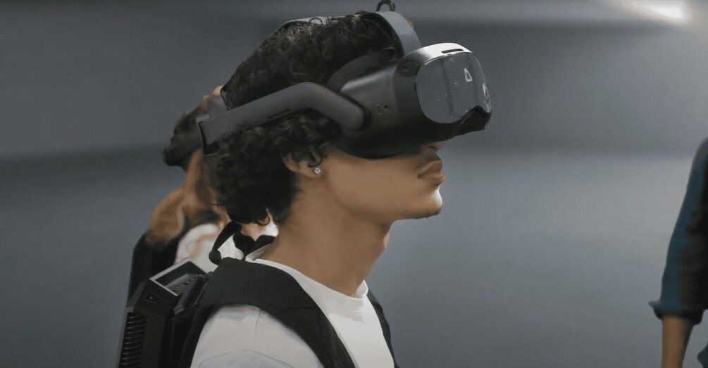 A person wearing a VR headset. 3